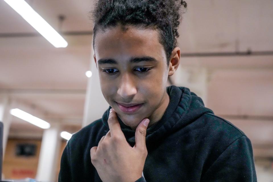 Student Jahzaviar Douglas works on his laptop. The Saturday school program helps students with their homework and allows them to catch up on missing assignments.