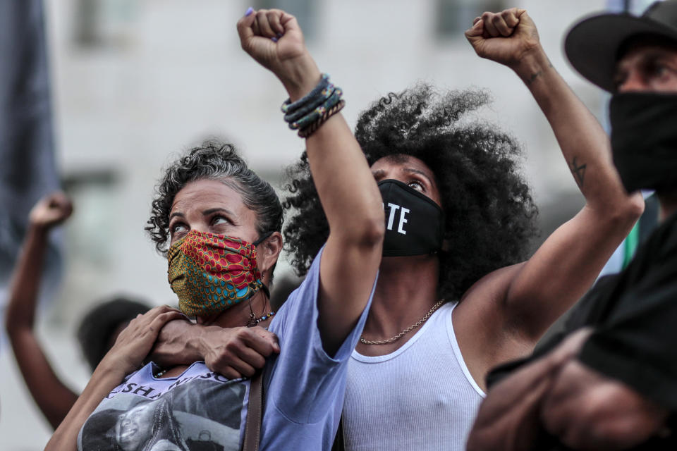 Image: Janaya Khan, embraces Black Lives Matter L.A. co-founder Melina Abdullah, left, at a downtown demonstration on Sept. 23, 2020. (Robert Gauthier / Los Angeles Times via Getty Images file)