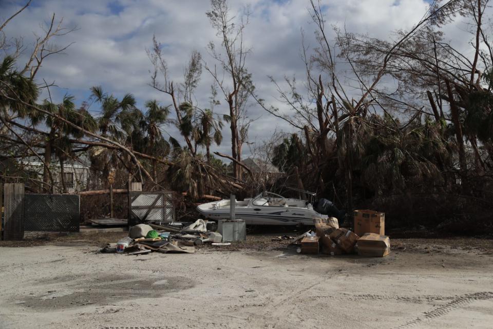 The owner of the Sanibel Deli & Coffee Factory returned Thursday, October 20, 2022, to clean out the restaurant on Sanibel. He found this boat behind the restaurant.