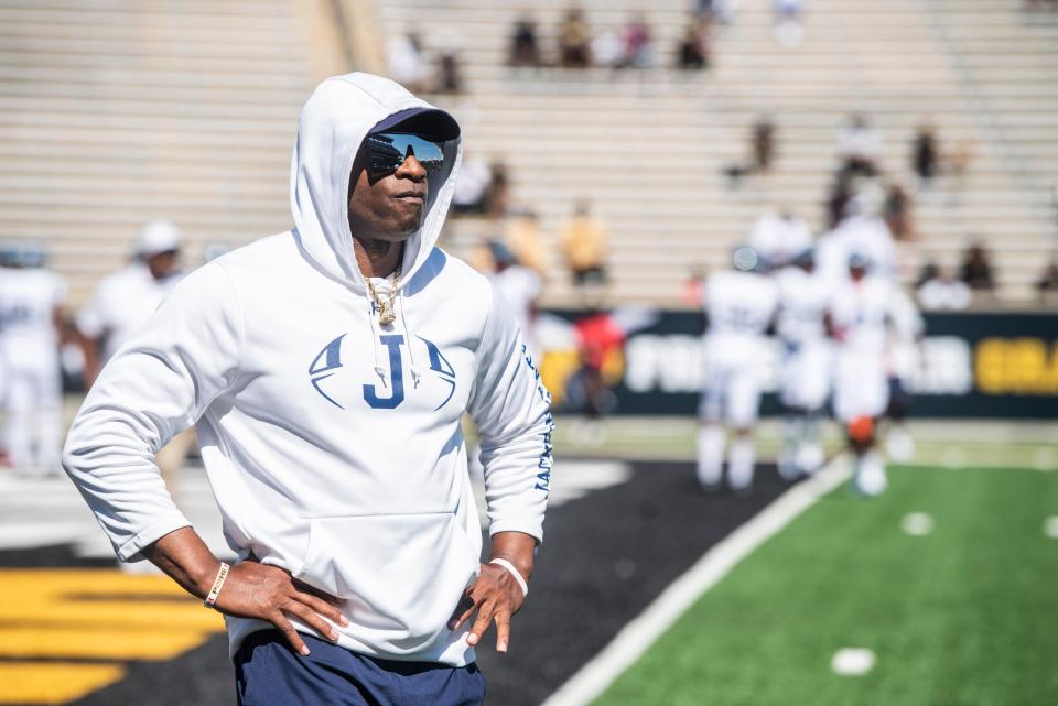 Jackson State football coach Deion Sanders watches his team warm up before their game on Oct. 8 against Alabama State.
