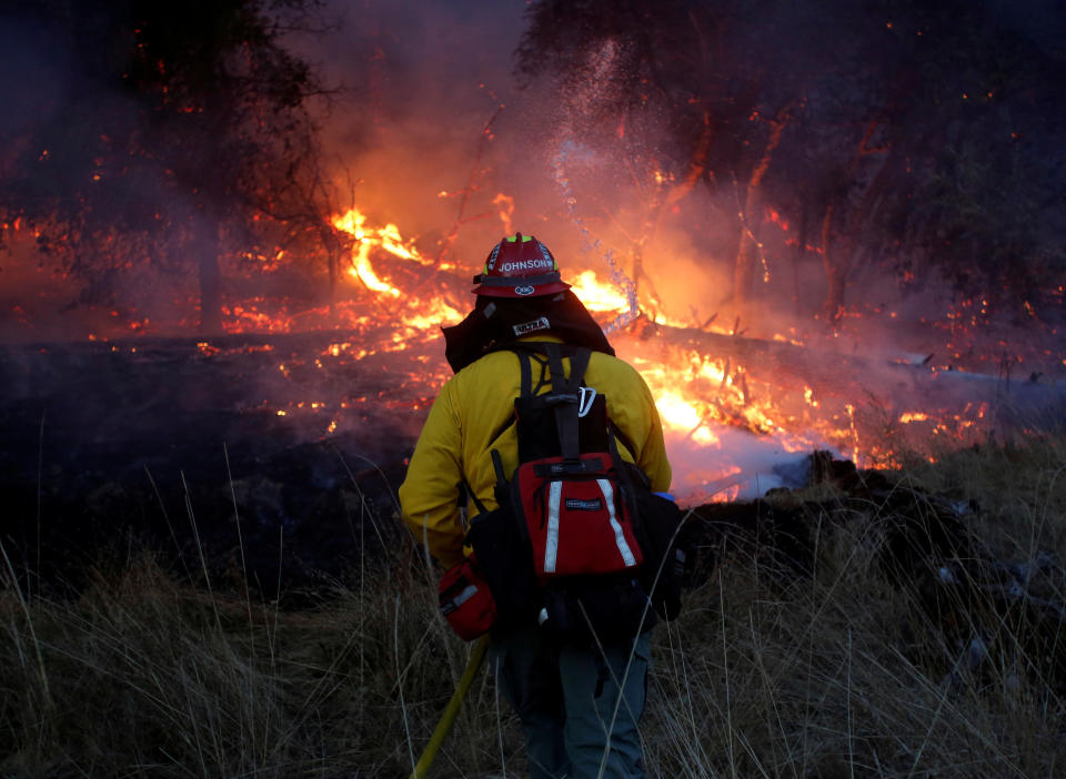 Firefighters battle a wildfire near Santa Rosa, California, U.S., October 14, 2017.&nbsp; (Photo: Jim Urquhart / Reuters)