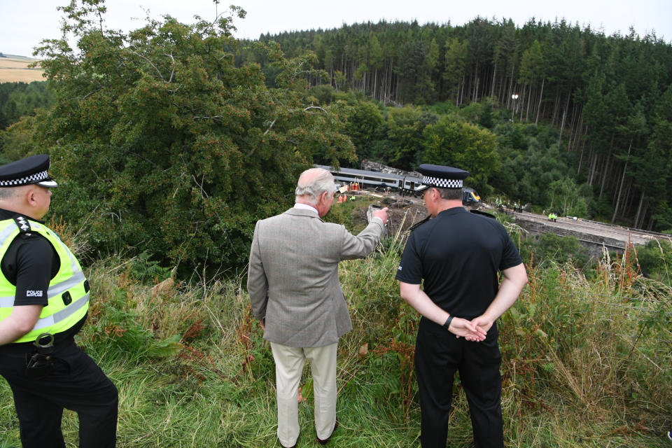 The Prince of Wales views the scene at Stonehaven tfollowing the ScotRail train derailment near Stonehaven, Aberdeenshire, which cost the lives of three people.