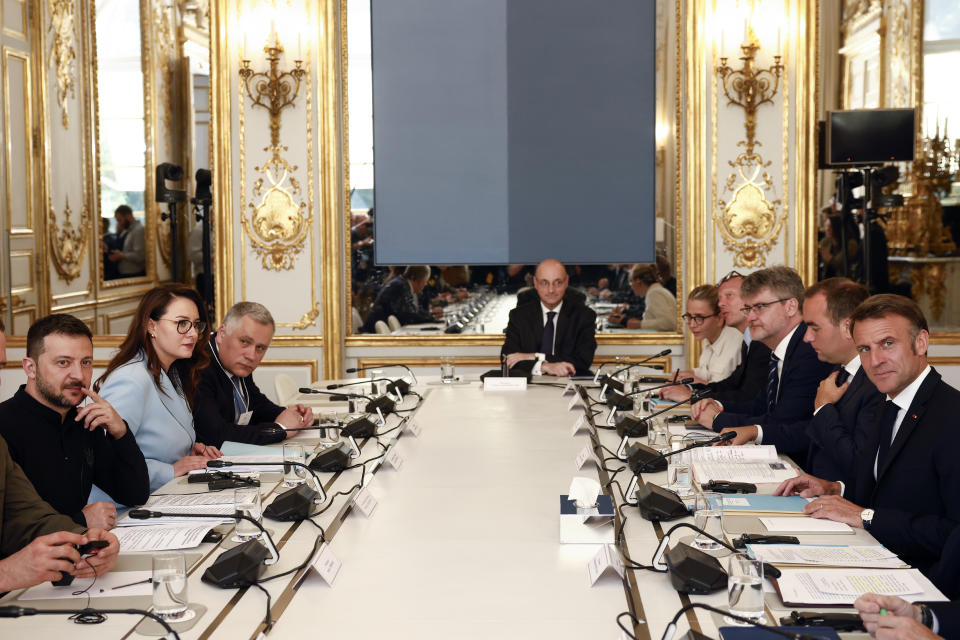 Ukrainian President Volodymyr Zelenskyy, left, meets French President Emmanuel Macron, Friday, June 7, 2024 at the Elysee Palace in Paris. U.S. President Joe Biden was due to meet with Ukrainian President Volodymyr Zelenskyy in Paris on Friday as Kyiv's army endures its hardest days of fighting since the early weeks of the war with Russia and prepares for what officials say could be a tough summer ahead. (Yoan Valat, Pool via AP)