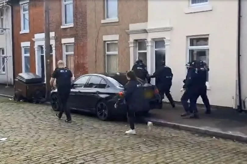 Police raiding the property in Stefano Road, Preston, this morning