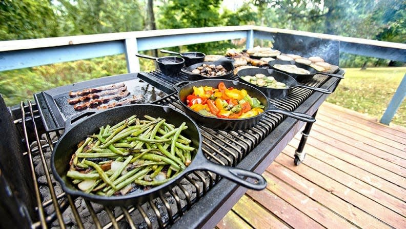 A good cast iron (or four) can help you cook up vegetable and more on the grill.