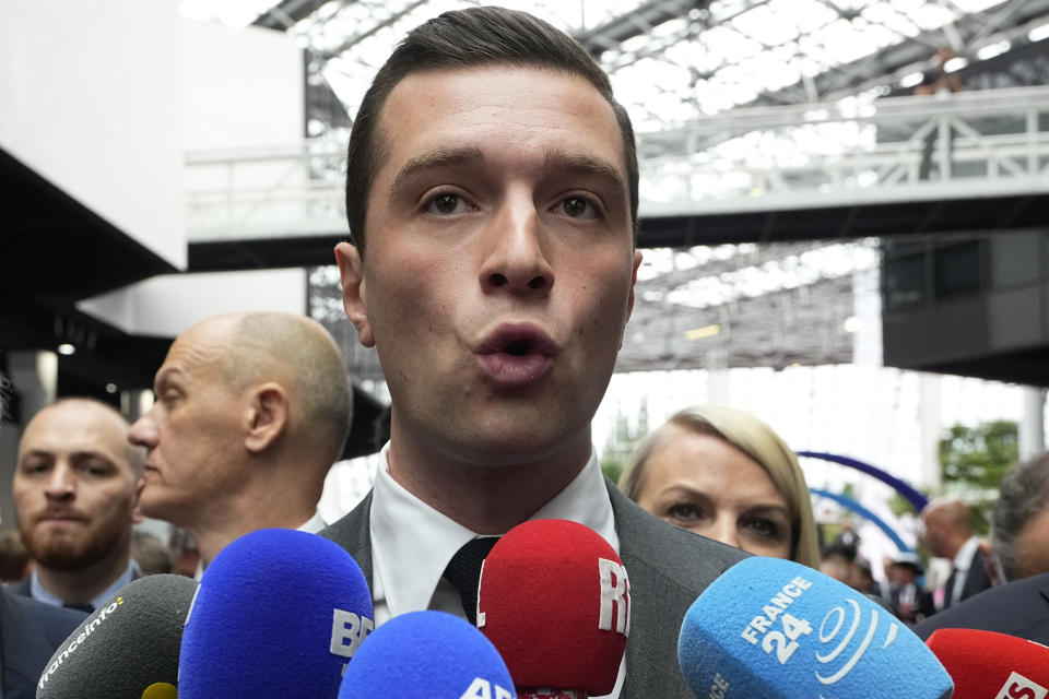 FILE - Jordan Bardella, president of the far-right National Front party, arrives at the Eurosatory Defense and security exhibition, Wednesday, June 19, 2024 in Villepinte, north of Paris. The perspective of a defeat in parliamentary elections mean he may have to share power with a prime minister from rival political party — that could possibly be far-right National Rally's president Jordan Bardella. Macron defeated twice the National Rally's leader Marine Le Pen in the presidential election, both in 2017 and 2022.( AP Photo/Michel Euler, File)