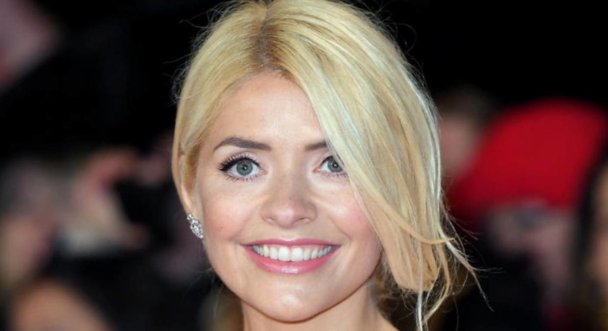 Holly Willoughby is ray of sunshine in yellow Ghost dress. (Getty Images) 
