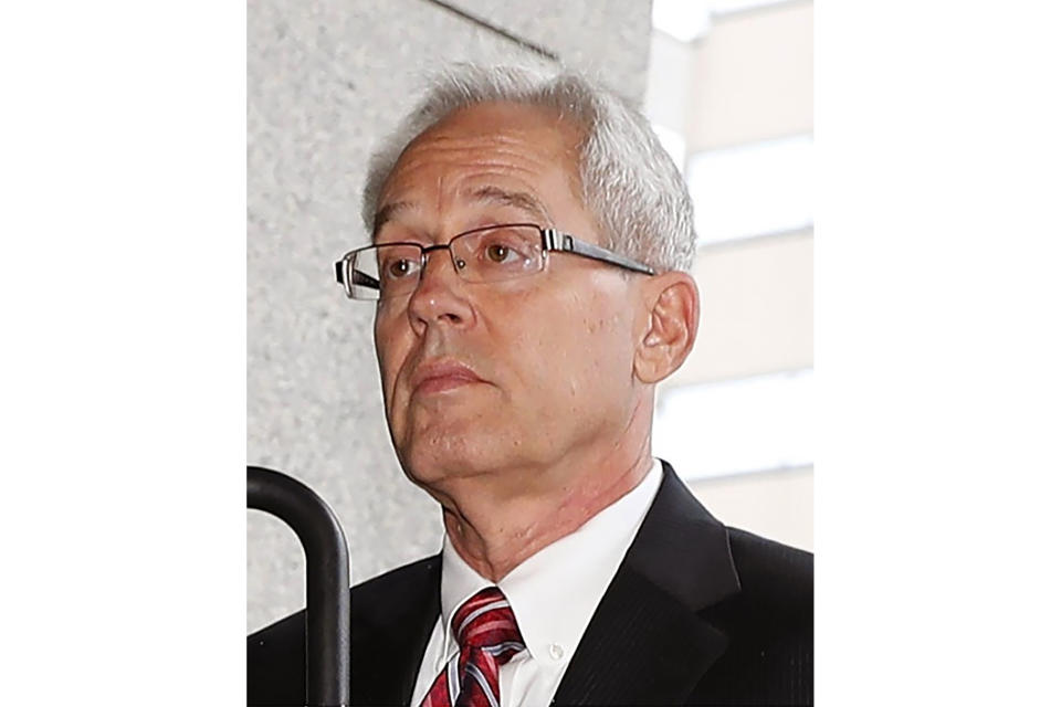 Former Nissan Motor Co.'s executive Greg Kelly arrives at a district court in Tokyo, on June 24, 2019. Kelly's trial in Tokyo District Court opens Sept. 15, nearly two years after his arrest, and the same day he turns 64 . If convicted of charges related to alleged under-reporting of former chairman Carlos Ghosn's income, Kelly could face up to a decade in prison. (Kyodo News via AP)