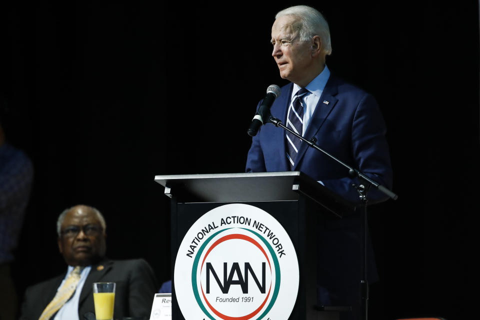 Rep. James Clyburn, D-S.C., left, listen to Democratic presidential candidate former Vice President Joe Biden speaks at the National Action Network South Carolina Ministers' Breakfast, Wednesday, Feb. 26, 2020, in North Charleston, S.C. (AP Photo/Matt Rourke)