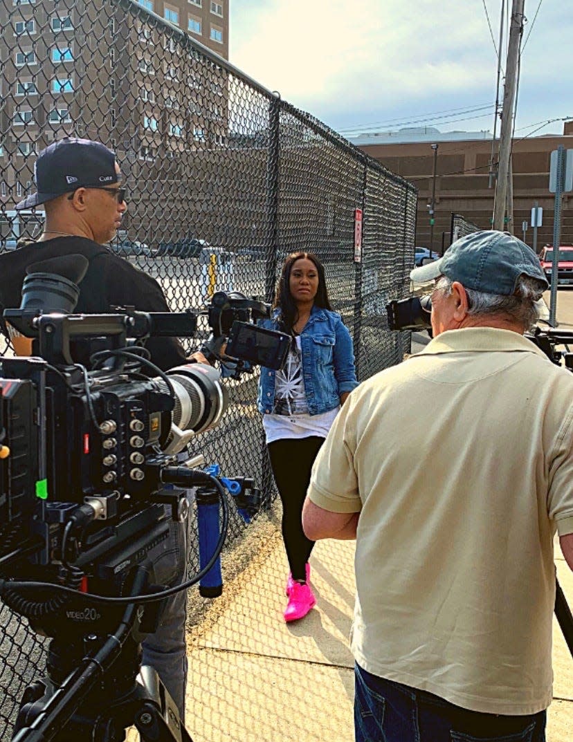 Ayana Bean of Brockton films outside of South Bay House of Correction where she was previously incarcerated. Here she is being interviewed for the BET original series "American Gangster: Trap Queens."