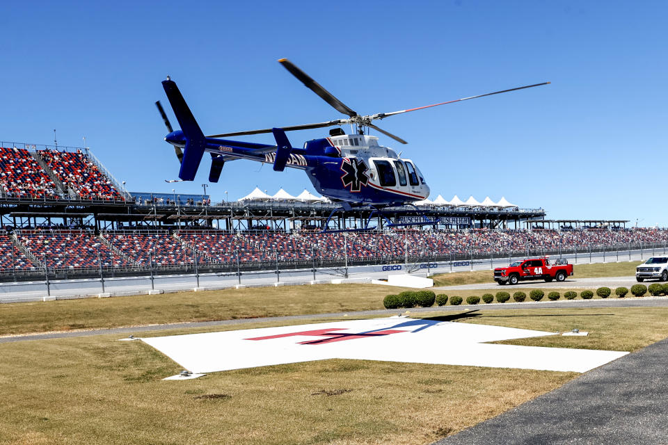 Driver Jordan Anderson airlifted by a helicopter to a local hospital after a fiery crash during the NASCAR Trucks Chevrolet Silverado 250 auto race, Saturday, Oct. 1, 2022, in Talladega, Ala. (AP Photo/Butch Dill)