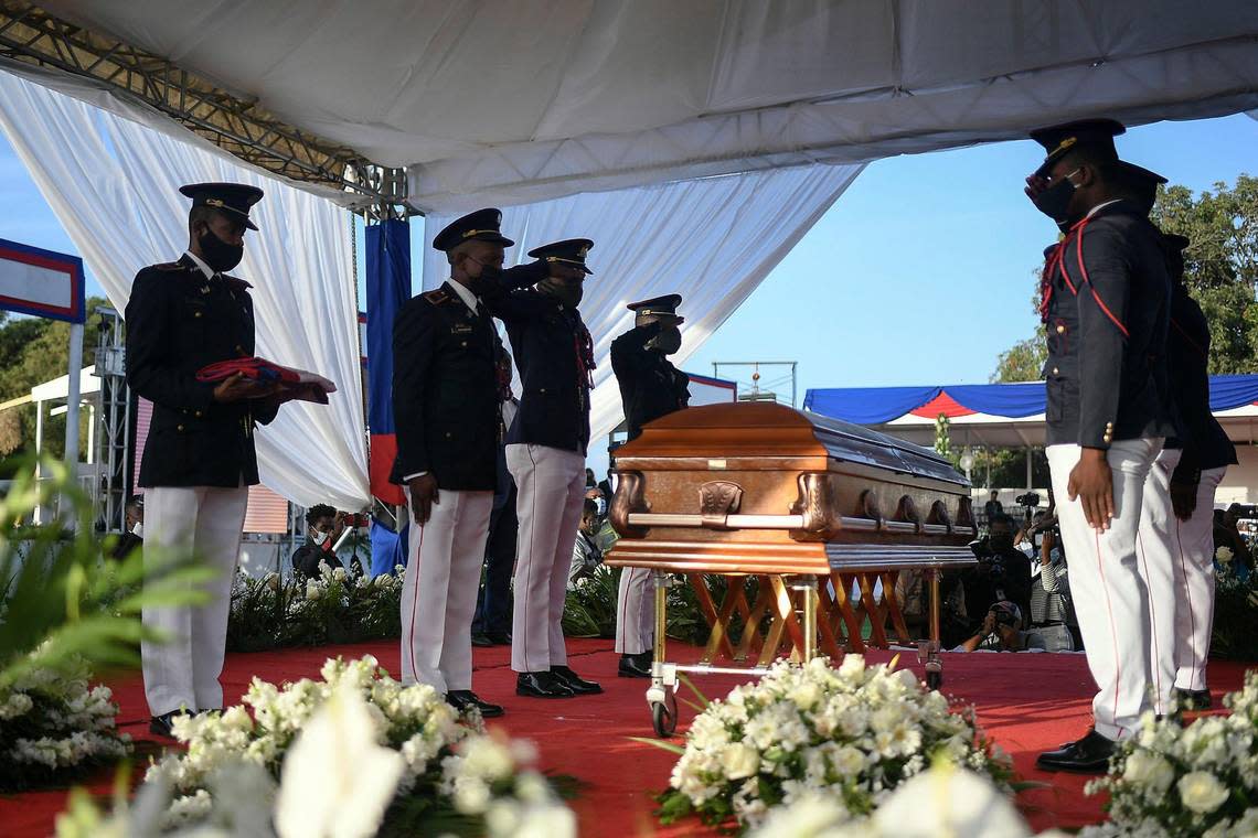 Police stand by the coffin of slain Haitian President Jovenel Moïse during his funeral in Cap-Haitien, Haiti, early Friday, July 23, 2021. Moïse was assassinated at his home in Port-au-Prince on July 7.