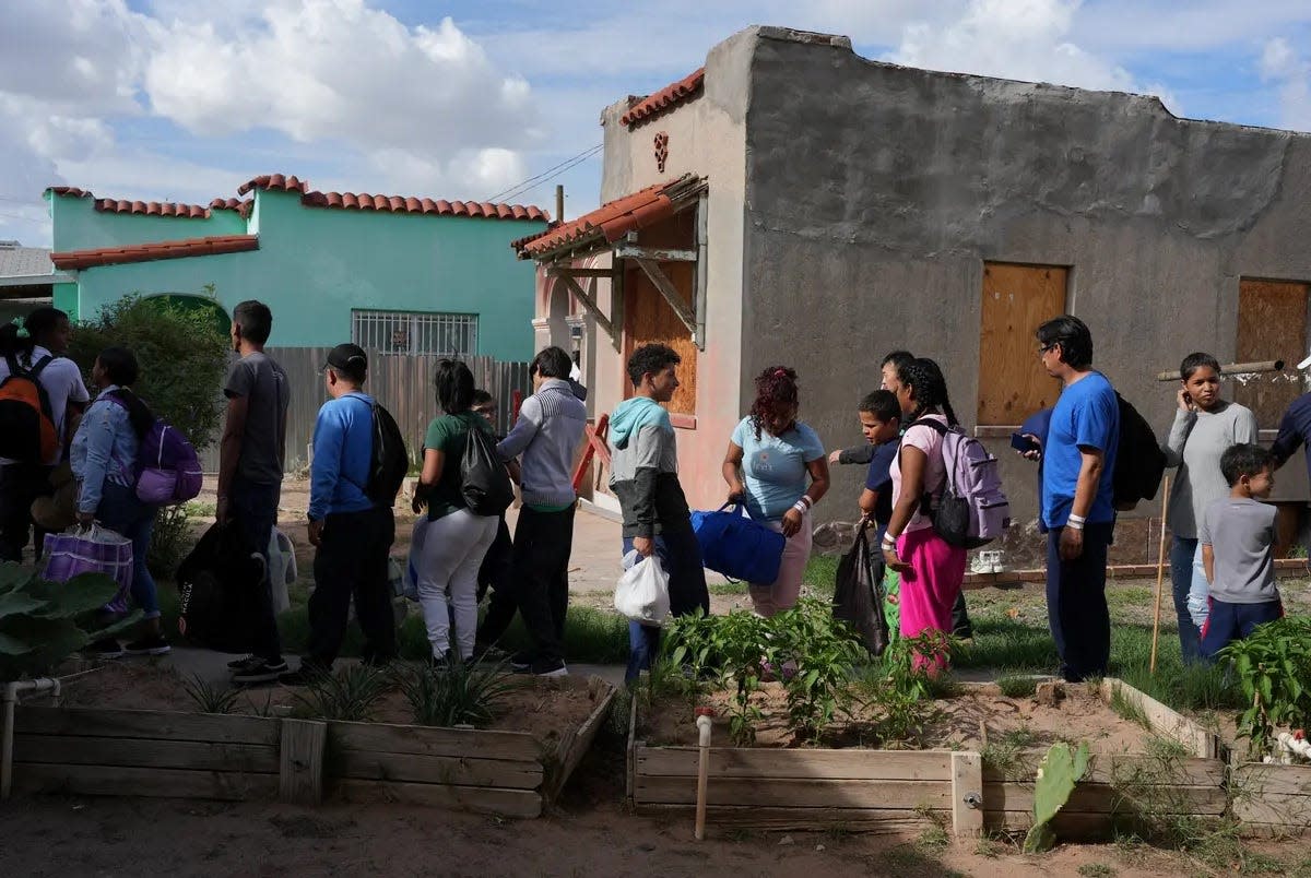 Venezuelan migrants wait in line to board a bus to New York at the Centro de los Trabajadores Agricolas Fronterizos in El Paso on Sept. 2, 2022. Texas flew 120 migrant passengers to Chicago on Tuesday as part of Gov. Greg Abbott's policy to send immigrants to Democratic-led cities he has described as sanctuaries.