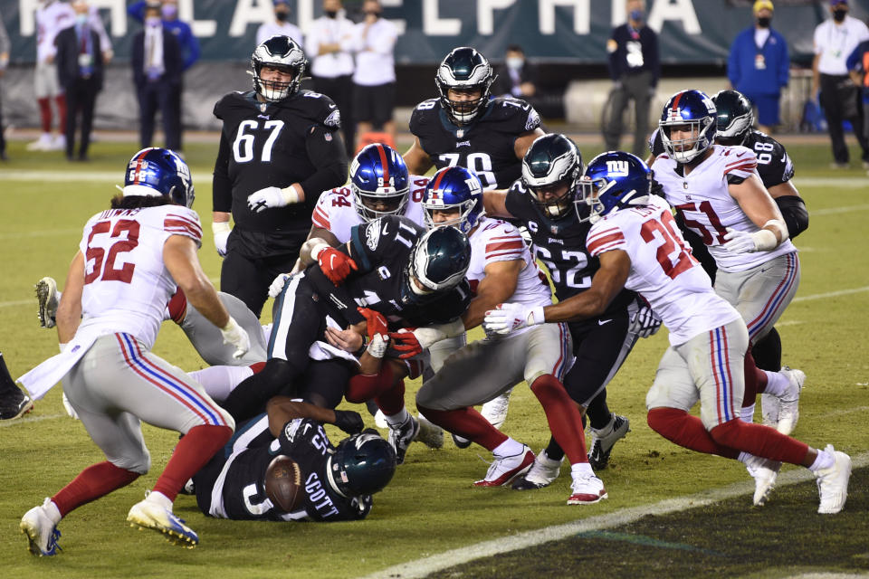 Philadelphia Eagles' Carson Wentz (11) cannot score on a two-point conversion attempt during the second half of an NFL football game against the New York Giants, Thursday, Oct. 22, 2020, in Philadelphia. (AP Photo/Derik Hamilton)