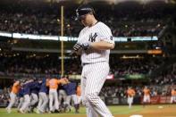 Oct 6, 2015; Bronx, NY, USA; New York Yankees catcher Brian McCann (34) walks off as the Houston Astros celebrate winning the American League Wild Card playoff baseball game at Yankee Stadium. Houston won 3-0. Adam Hunger-USA TODAY Sports