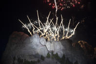 Fireworks light the sky at Mount Rushmore National Memorial, Friday, July 3, 2020, near Keystone, S.D., after President Donald Trump spoke. (AP Photo/Alex Brandon)