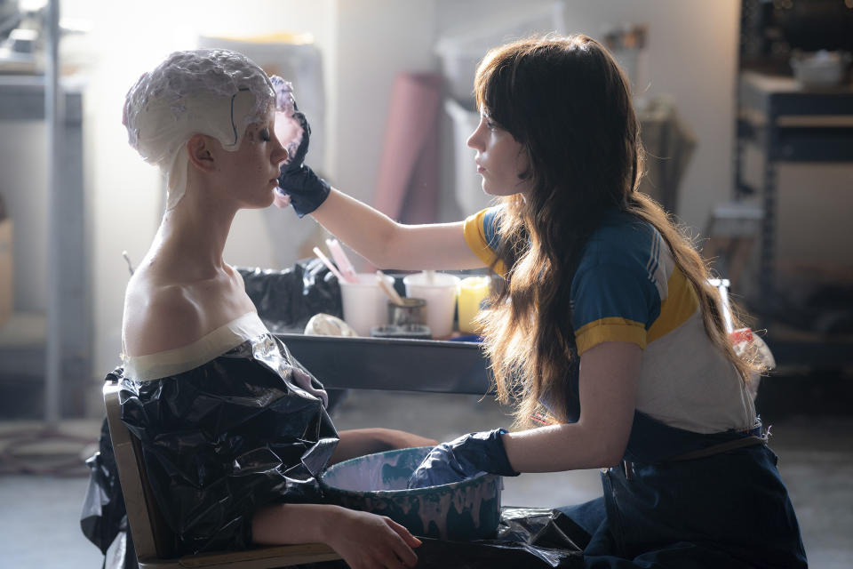 This image released by A24 shows Mia Goth, left, and Sophie Thatcher in a scene from "MaXXXine." (Justin Lubin/A24 via AP)