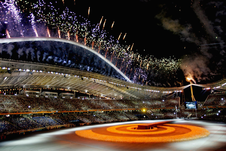 Fireworks are seen during the closing ceremony of the Athens 2004 Summer Olympic Games. (Photo by Stuart Franklin/Getty Images)