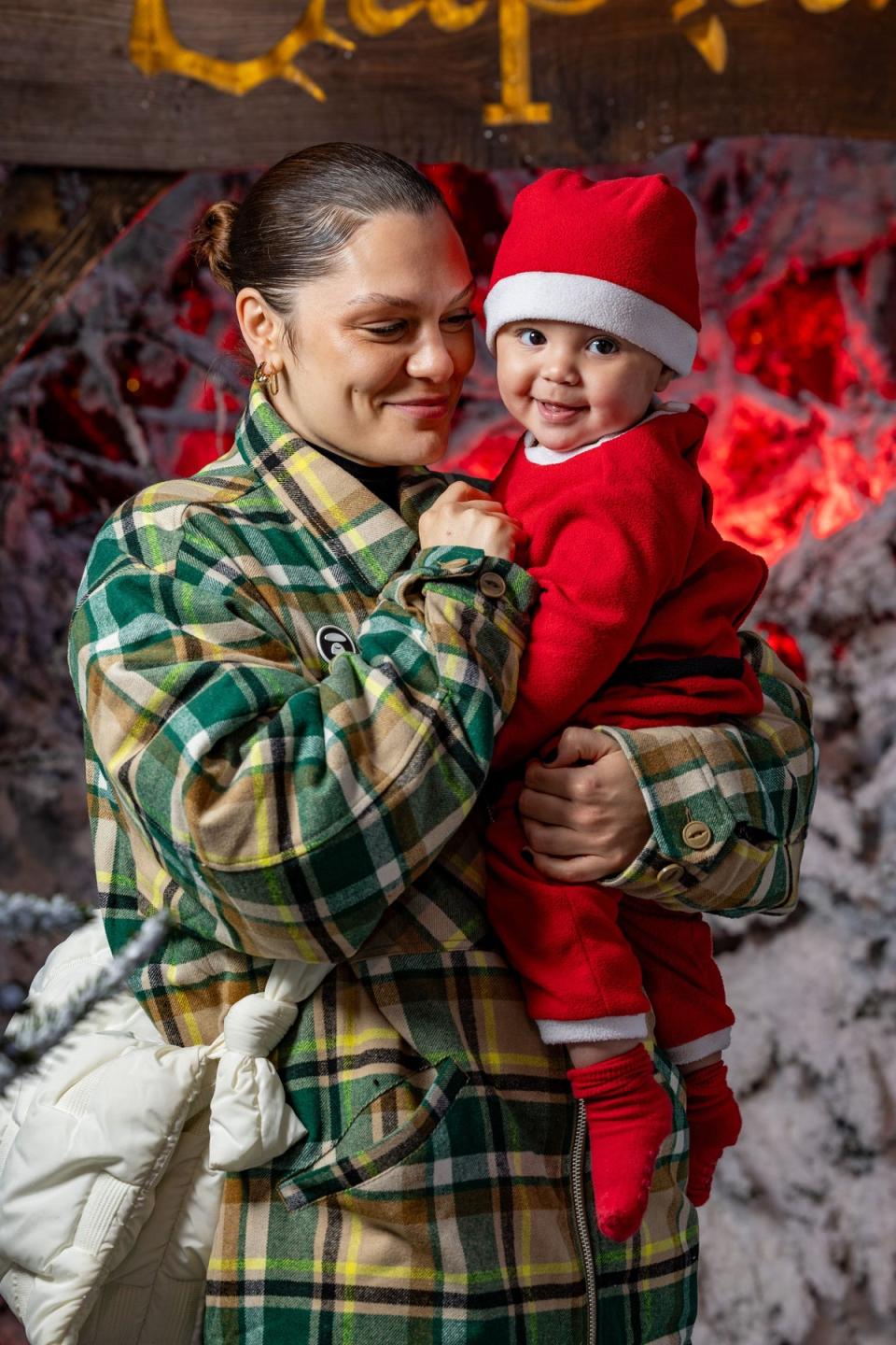 Jessie J posed with her baby Sonny who sported a red and white Father Christmas outfit (Getty Images)