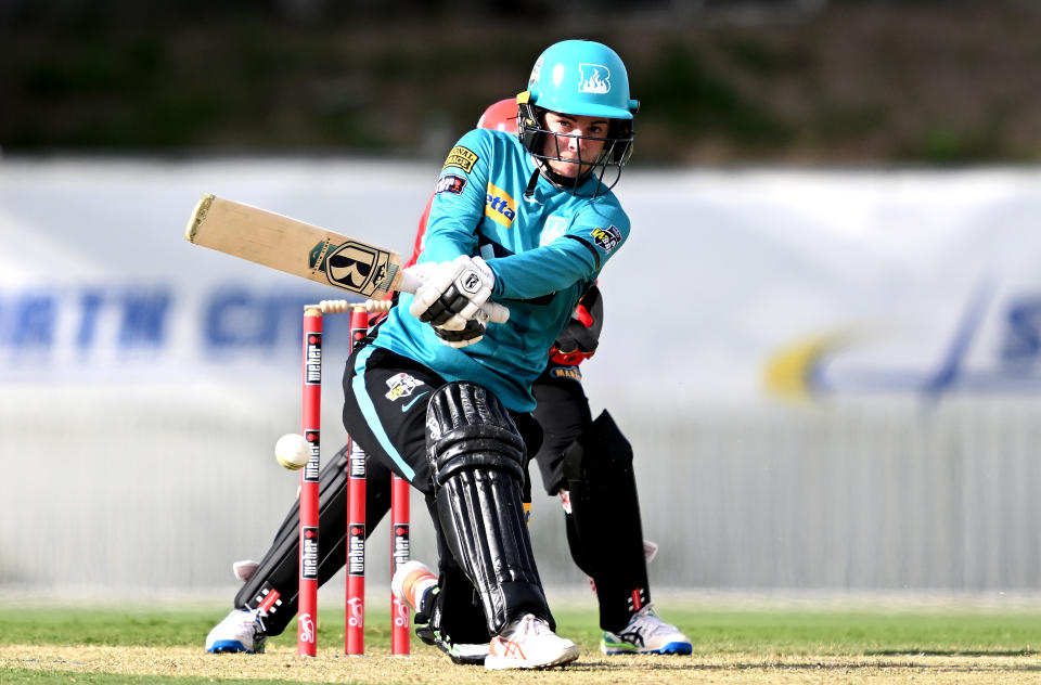 Seen here, Brisbane Heat batter Georgia Redmayne smashes a shot against the Melbourne Renegades in the WBBL.