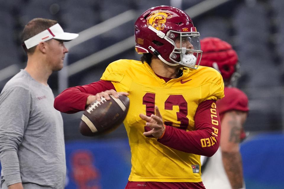 Southern California quarterback Caleb Williams (13) practices ahead of the Cotton Bowl NCAA college football game against Tulane, Thursday, Dec. 29, 2022, in Arlington, Texas. The Cotton Bowl is scheduled for Monday, Jan. 2, 2023. (AP Photo/Sam Hodde)