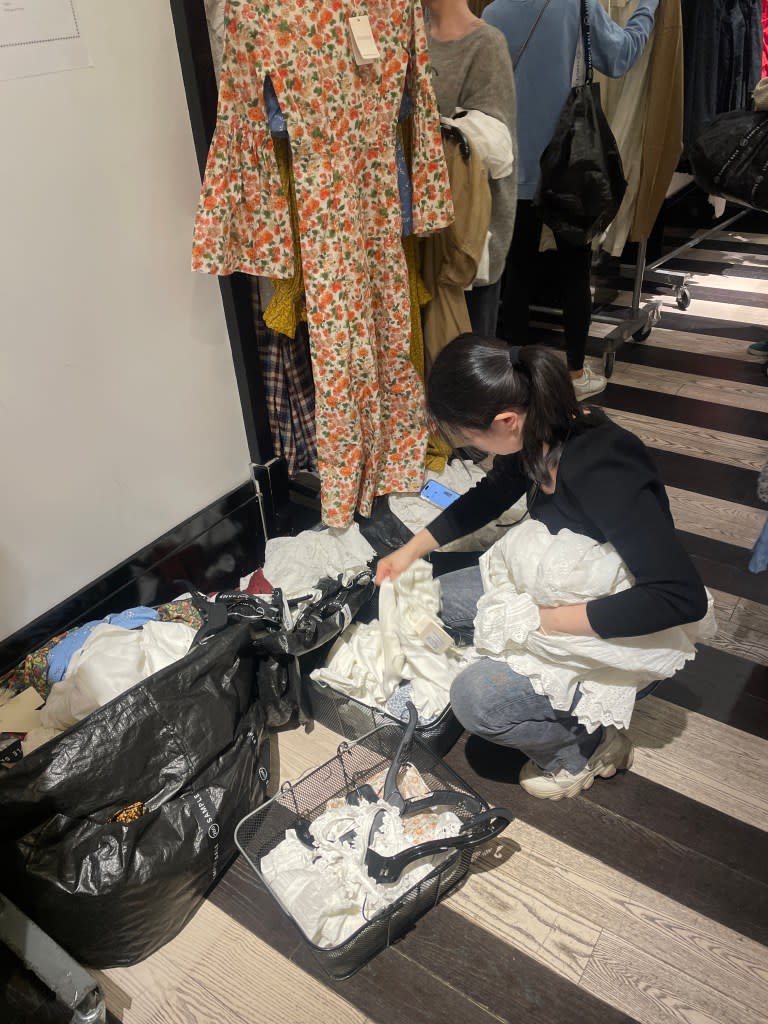 Davey photographed the scene at the DÔEN sample sale last week where she spotted shoppers stockpiling clothing so others couldn’t shop it first. Credit: courtesy of Davey