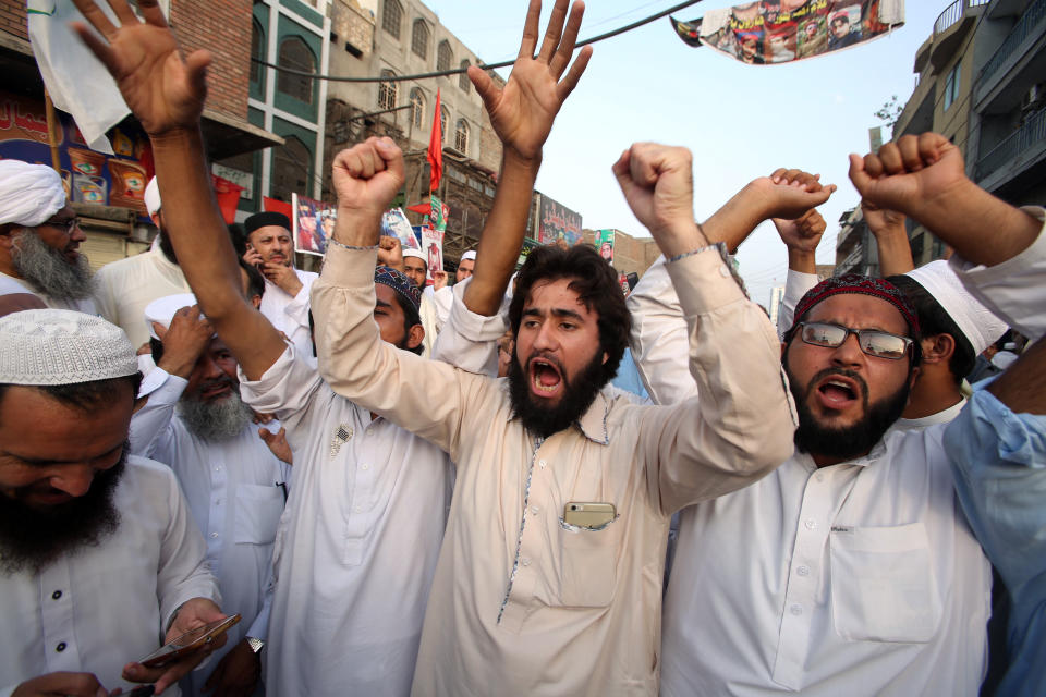 Supporters of different political parties demonstrate to reject the election results in Peshawar, Pakistan, Friday, July 27, 2018. With Pakistani election officials declaring the party of Imran Khan to be the winner of parliamentary balloting, the former cricket star turned Friday to forming a coalition government, since the party did not get an outright majority.(AP Photo/Muhammad Sajjad)