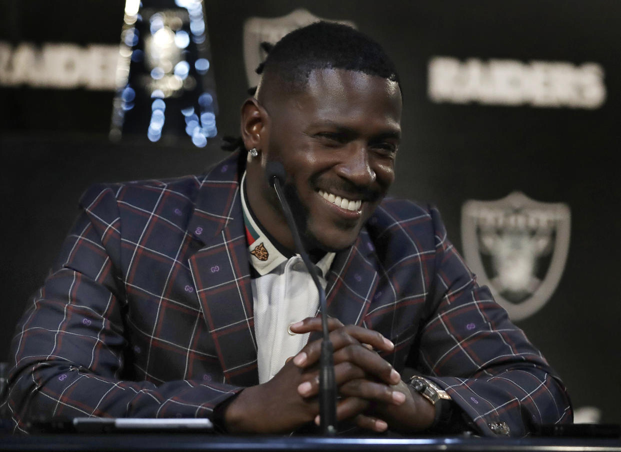 Oakland Raiders wide receiver Antonio Brown smiles during an NFL football news conference (AP Photo)