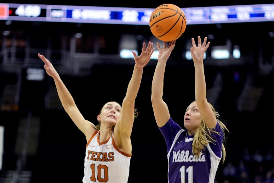 Kansas State guard Taryn Sides gets past Texas guard Shay Holle to put up a shot during the first half of their Big 12 Tournament semifinal game Monday in Kansas City, Mo.