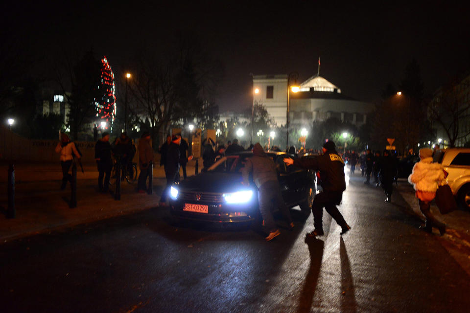 Protesters try to block the exit of the Polish Parliament in Warsaw