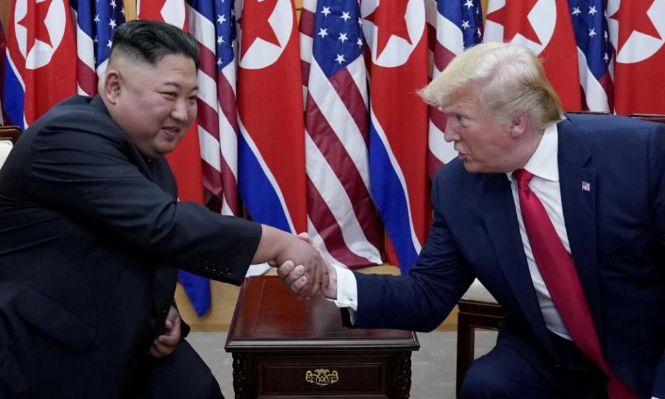 Donald Trump shakes hands with Kim Jong-un at the demilitarized zone separating the two Koreas, in June 2019.