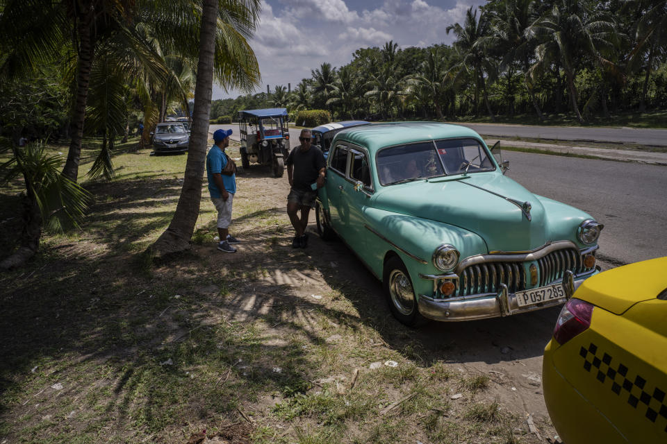 People wait in line to be able to refuel their cars in Havana, Cuba, Monday, April 24, 2023. Cuba’s capital has been restricting fuel sales, threatening to further weaken an economy reeling from power blackouts and rampant inflation. (AP Photo/Ramon Espinosa)