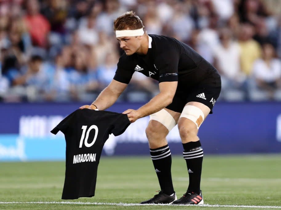 <p>Captain Sam Cane lays down a shirt in tribute to Maradona</p>Getty Images