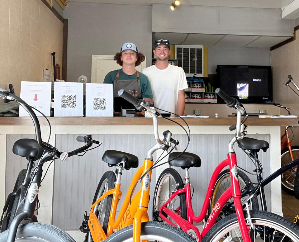 Island Adventures co-owner by Nicholas Brownell, right, joins shop manager Nixon Brownell inside the newly opened business at 4 Spring Wharf.