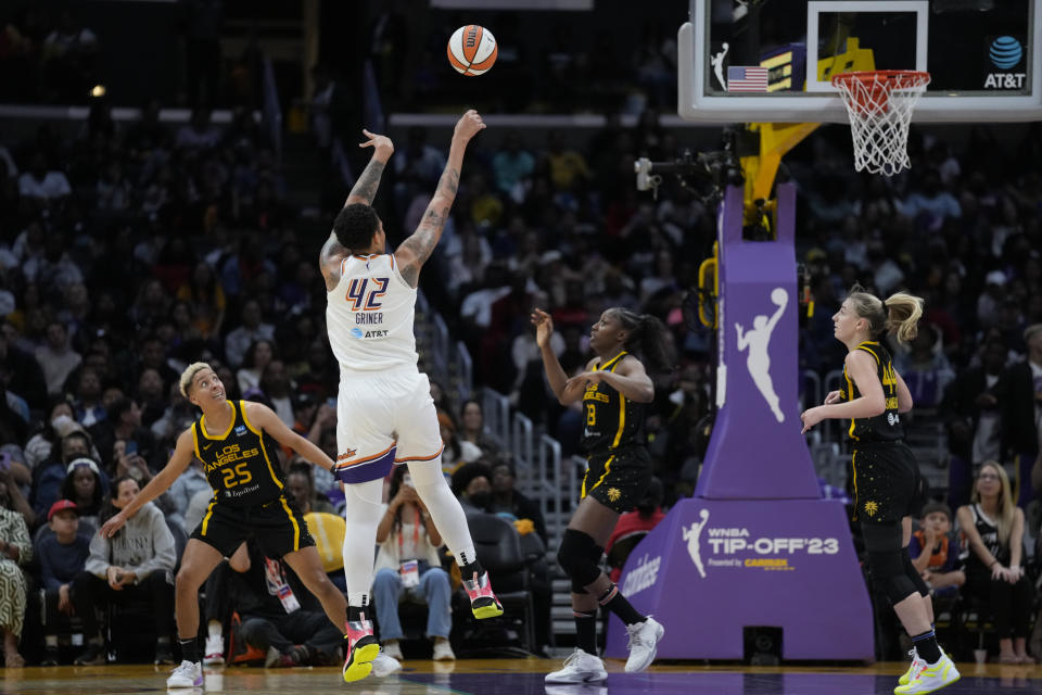 Phoenix Mercury center Brittney Griner (42) shoots against Los Angeles Sparks forward Layshia Clarendon (25) during the first half of a WNBA basketball game in Los Angeles, Friday, May 19, 2023. (AP Photo/Ashley Landis)