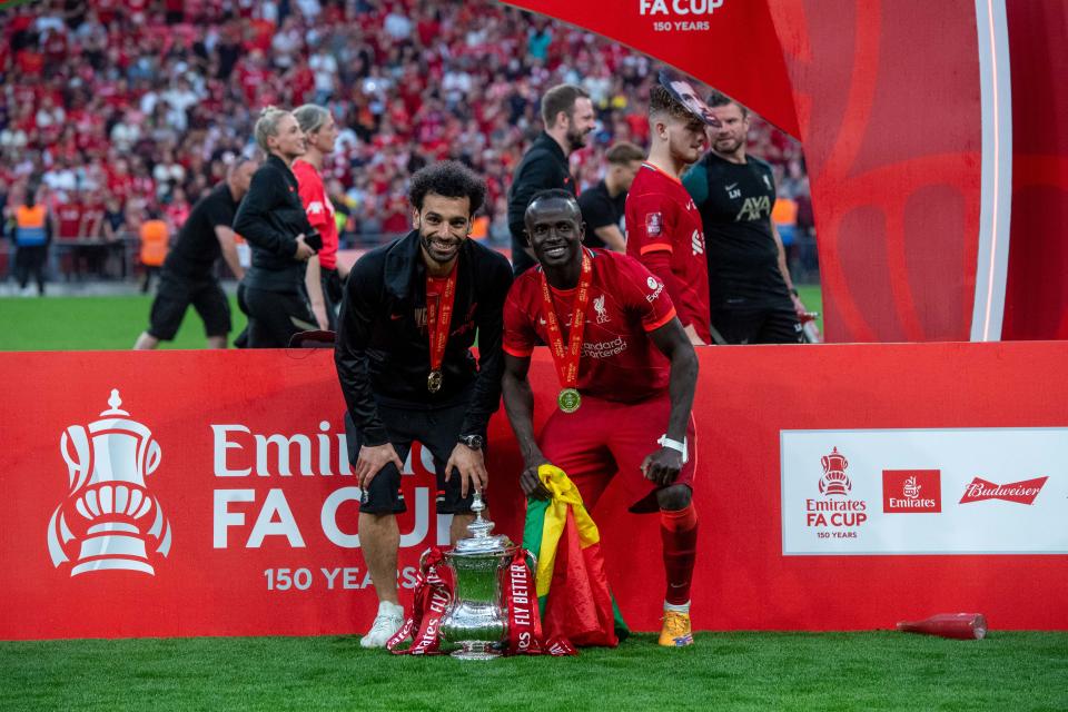 LONDON, ENGLAND - MAY 14: Mohamed Salah and Sadio Mane of Liverpool celebrates after winning during The FA Cup Final match between Chelsea and Liverpool at Wembley Stadium on May 14, 2022 in London, England. (Photo by Sebastian Frej/MB Media/Getty Images)