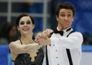 Canada's Tessa Virtue and Scott Moir compete during the Figure Skating Ice Dance Short Dance Program at the Sochi 2014 Winter Olympics, February 16 2014. REUTERS/Alexander Demianchuk (RUSSIA - Tags: SPORT FIGURE SKATING SPORT OLYMPICS TPX IMAGES OF THE DAY)