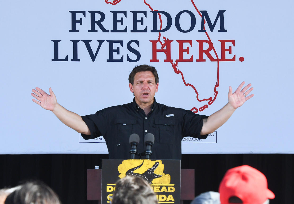 Florida Gov. Ron DeSantis speaks from a podium at a campaign event.