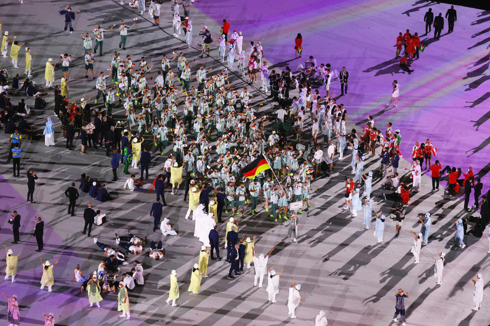 <p>TOKYO, JAPAN - JULY 23: Flag bearers Laura Ludwig and Patrick Hausding of Team Germany lead their team out during the Opening Ceremony of the Tokyo 2020 Olympic Games at Olympic Stadium on July 23, 2021 in Tokyo, Japan. (Photo by Richard Heathcote/Getty Images)</p> 