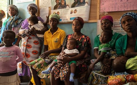 Women attend a Ghanian health service clinic in Dabo village, Upper West region - Credit: Simon Townsley/The Telegraph