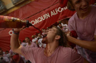 <p>Revellers party during the launch of the <em>chupinazo</em> rocket to celebrate the official opening of the 2017 San Fermín Fiesta. (Photo: Alvaro Barrientos/AP) </p>