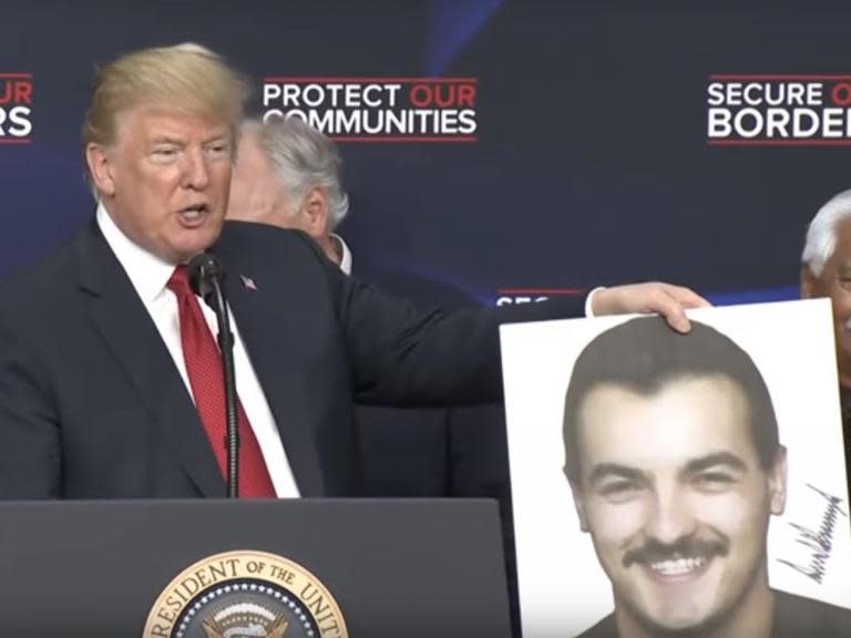 Trump autographs photo of murder victim then compares him to Tom Selleck