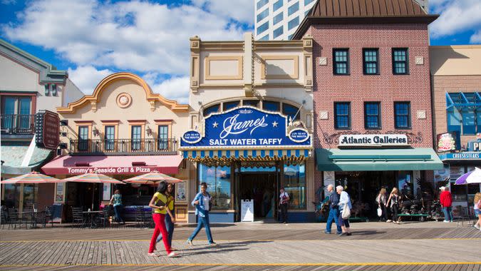 Atlantic City, New Jersey, USA - September 22, 2013:  People walking the Atlantic City Boardwalk in NJ on September 22, 2013.