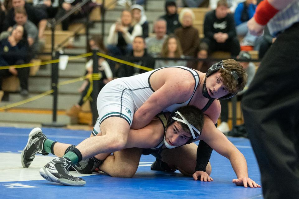 Minisink's Zack Ryder, top wrestles Pine Bush's Braydon Pennell, bottom in the 189lb weight class in the Section 9 Division I wrestling finals in Central Valley, NY on Saturday February 11, 2023.ALLYSE PULLIAM/For the Times-Herald Record.