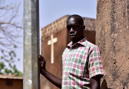 A displaced protestant, who fled from Dablo, stands outside a church in the city of Kaya, Burkina Faso May 16, 2019. REUTERS/Anne Mimault