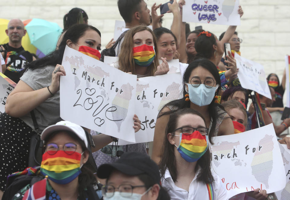 Participants rally during the "Taiwan Pride March for the World!" at Liberty Square at the CKS Memorial Hall in Taipei, Taiwan, Sunday, June 28, 2020. This year marks the first Gay Pride march in Chicago 1970, and due to the COVID-19 lockdown, Taiwan is one of the very few countries to host the world's only physical Gay Pride. (AP Photo/Chiang Ying-ying)
