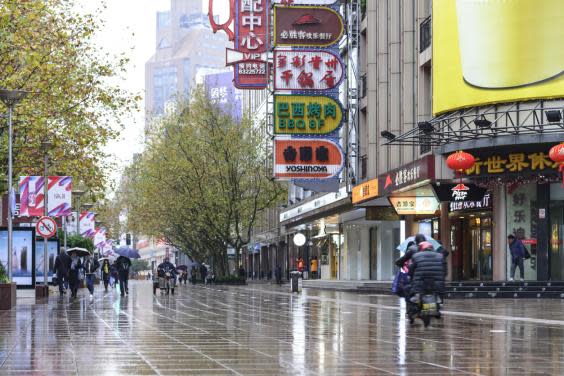 Explore areas like Nanjing East Road before the crowds arrive (Getty)