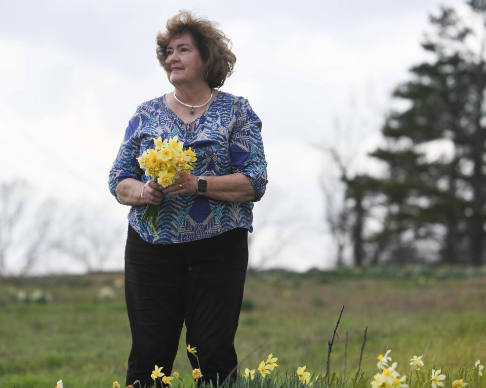 Jackson Woman of the Year Judy Renshaw plucks flowers off her family's property in Jackson, Tenn., on Thursday, March 14, 2024