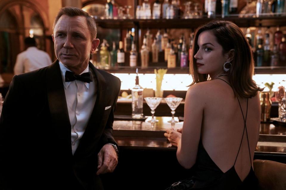 Daniel Craig as James Bond and Ana de Armas as Paloma in No Time To Die