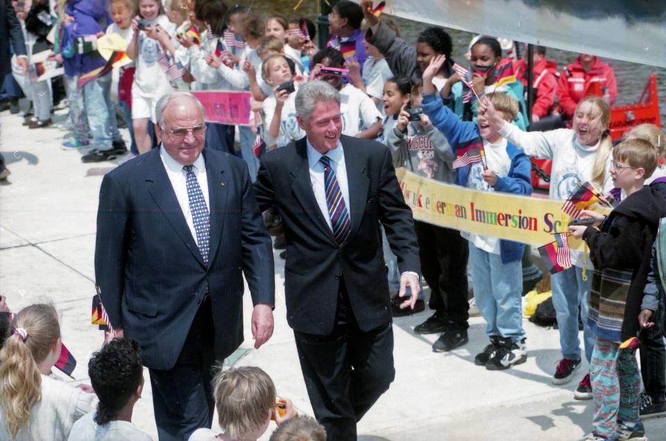 German Chancellor Helmut Kohl, left, and U.S. President Bill Clinton arrive in Milwaukee's Pere Marquette Park, where the world leaders spoke at a large gathering on May 23, 1996.